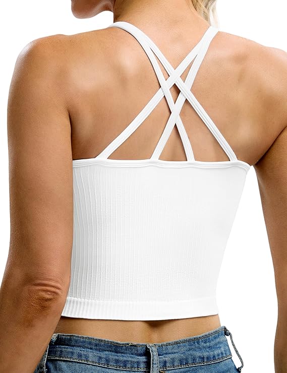 A woman wearing a white ribbed crop top with crisscross straps on the back and blue jeans, shown from behind on a plain white background.