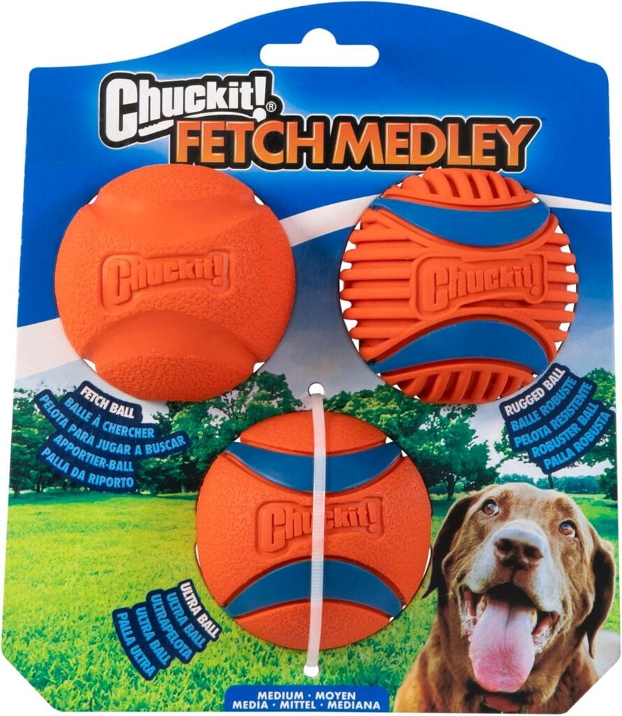 Chuckit! Fetch Medley set with three orange and blue dog balls in a package, labeled Fetch Ball, Ultra Ball, and Rugged Ball. A happy brown dog is pictured in the lower right corner.