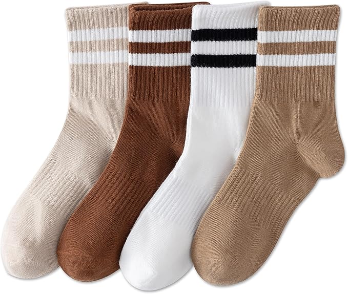 Four pairs of ribbed crew socks in neutral tones, each with two horizontal stripes near the top: beige with white stripes, brown with white stripes, white with black stripes, and tan with white stripes.