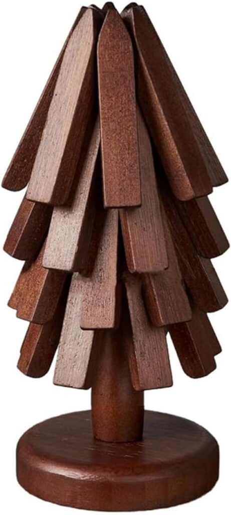 A small, stylized wooden tree sculpture with layered, flat branches arranged in a conical shape, standing on a round base.