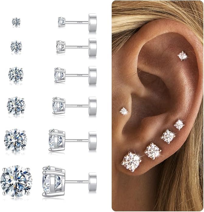 A set of six pairs of round, silver stud earrings with clear gemstones is shown on the left. On the right, an ear displays the earrings in multiple piercings of varying sizes from small to large.