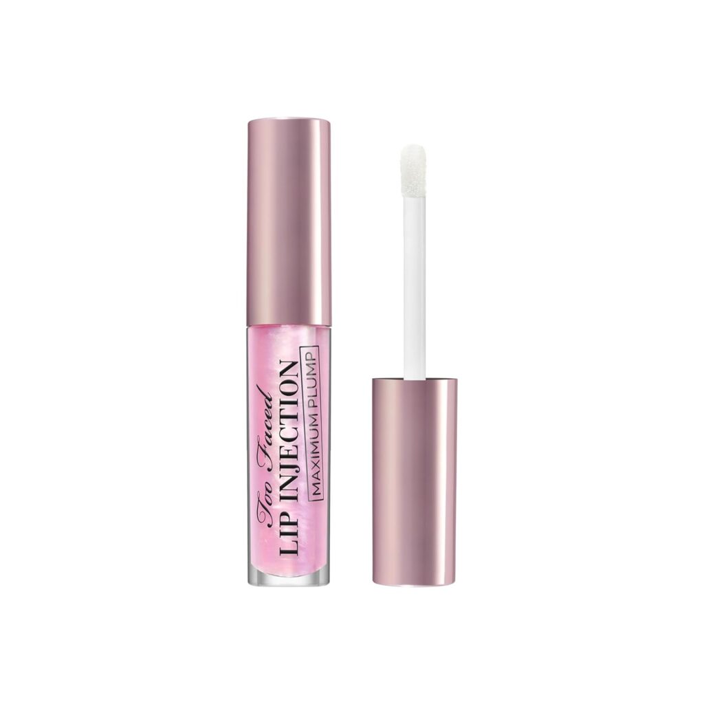 A tube of Too Faced Lip Injection Maximum Plump lip gloss in light pink with a rose-gold cap, shown with the cap off and a white applicator wand beside it.