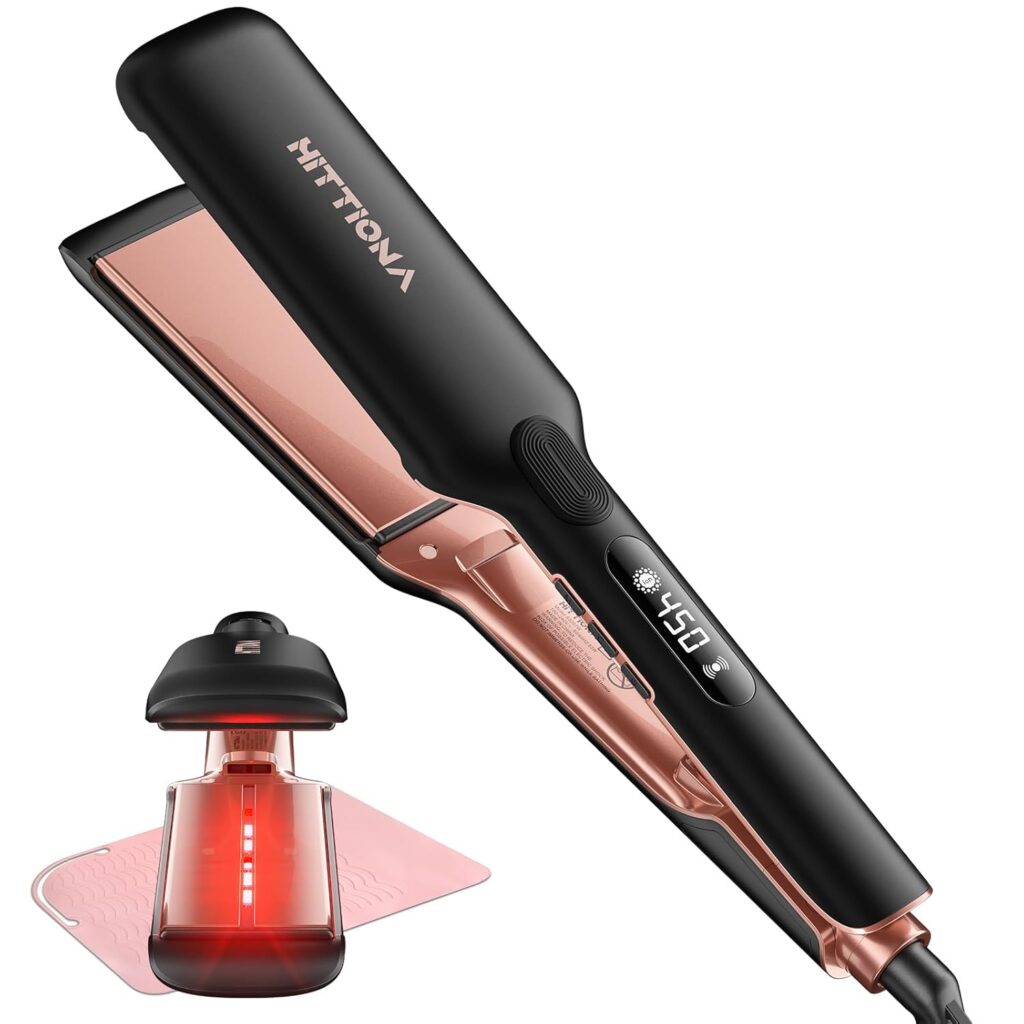A black and rose gold hair straightener with digital temperature display, showing 450°F, next to a pink silicone mat and a small device emitting red light.