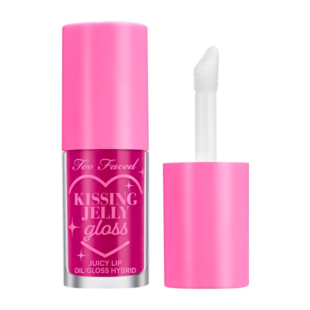 A pink tube of Too Faced Kissing Jelly Gloss with the applicator wand removed, showing a bright pink lip gloss inside. The packaging reads "Juicy Lip Oil/Gloss Hybrid.