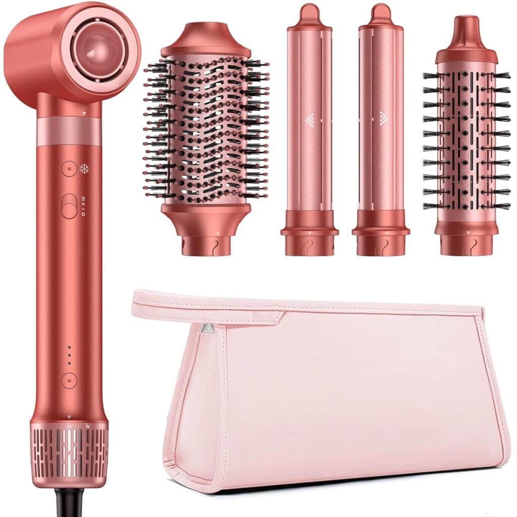 A rose gold hair styling tool set with a main handle, four interchangeable attachments (round brushes and curling wands), and a light pink storage pouch.
