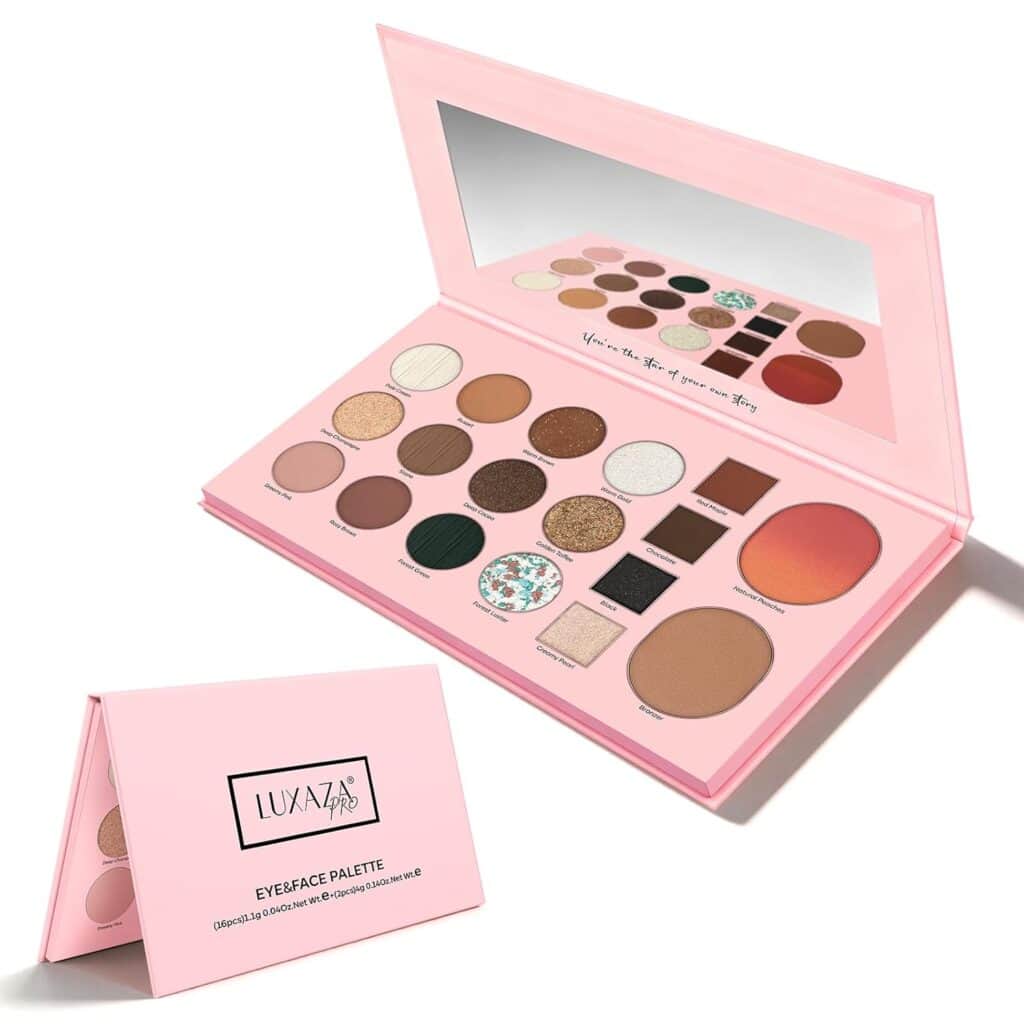 A pink makeup palette with a mirror, showing various shades of eyeshadow, blush, and contour powders. The closed palette displays the "LUXAZA" logo and the words "EYEFACE PALETTE" in black text.