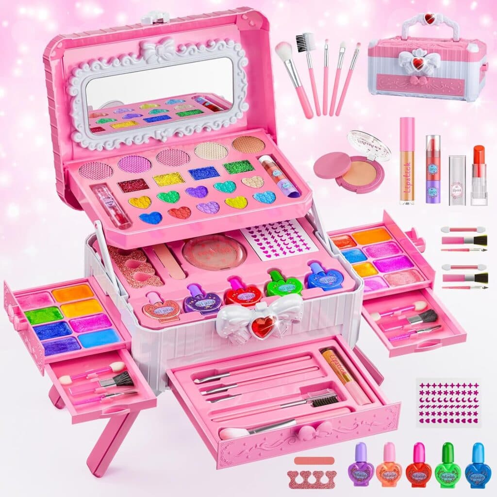 A pink and white makeup toy set with a mirror, eyeshadows, brushes, lipsticks, nail polishes, and accessories arranged in an open case with drawers, surrounded by additional makeup items and stickers.