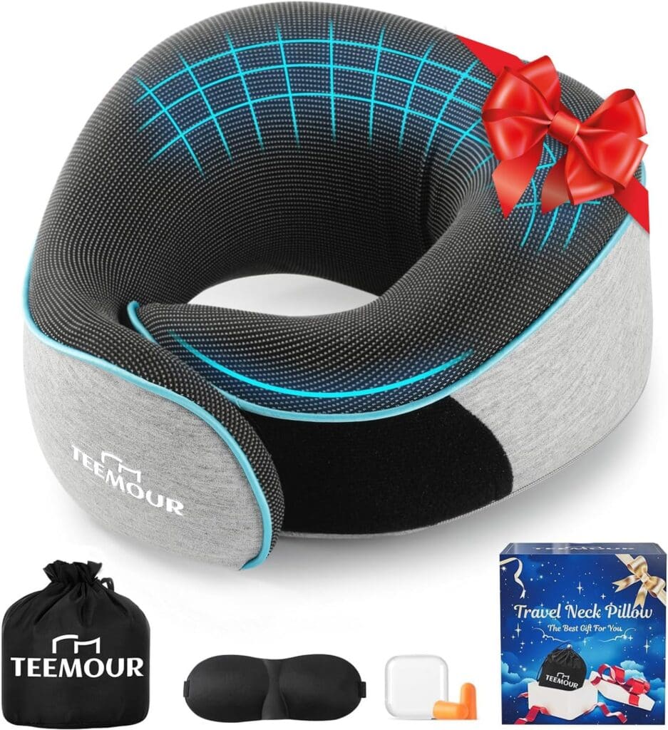 A gray and black TEEMOUR travel neck pillow with blue grid lines, decorated with a red bow. Includes a black carrying bag, eye mask, orange earplugs, and a travel pillow gift box.