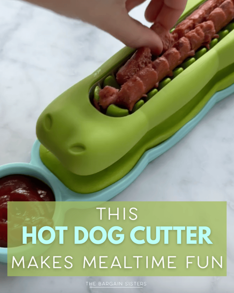 A hand uses a green Hot Dog Cutter shaped like an alligator to slice a hot dog, with ketchup in a side compartment. Text reads: "This Hot Dog Tool makes mealtime fun.”.