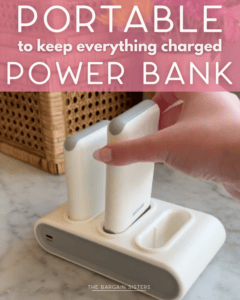 A hand places a portable power bank into a white charging dock with two slots. Text on the image reads, “Portable to keep everything charged. Power Bank.”.