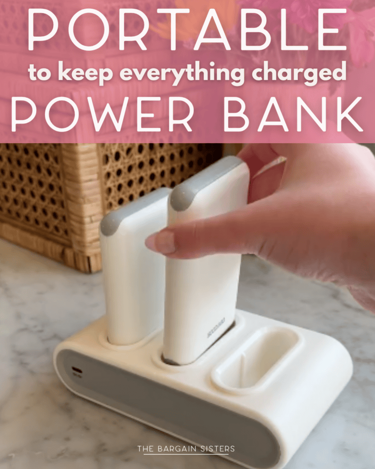 A hand places a portable power bank into a white charging dock with two slots. Text on the image reads, “Portable to keep everything charged. Power Bank.”.