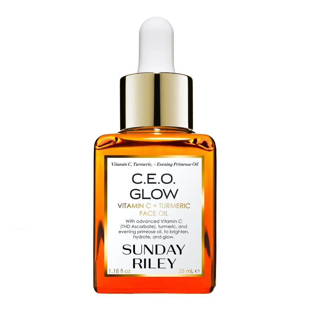 A bottle of Sunday Riley C.E.O. Glow Vitamin C + Turmeric Face Oil with a gold and white dropper cap, featuring orange-tinted oil inside a rectangular glass container.