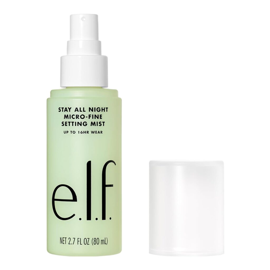 A green bottle of e.l.f. Stay All Night Micro-Fine Setting Mist with a white pump and a clear plastic cap placed beside it. The label indicates up to 16 hours of wear and the bottle contains 2.7 fl oz (80 ml).