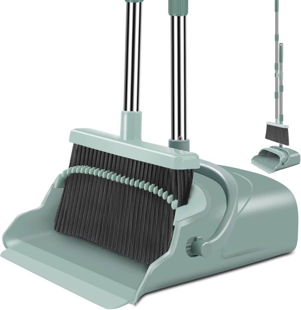 A green dustpan and broom set with long handles. The broom fits neatly into the dustpan, which has built-in teeth for cleaning the broom bristles. An inset shows the set in a folded, compact storage position.