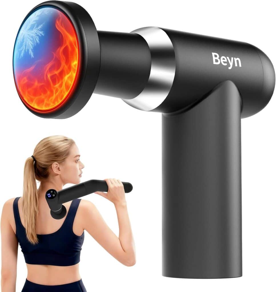 A woman uses a black Beyn massage gun with a round head showing a hot and cold effect, represented by flames and a snowflake, on her shoulder.