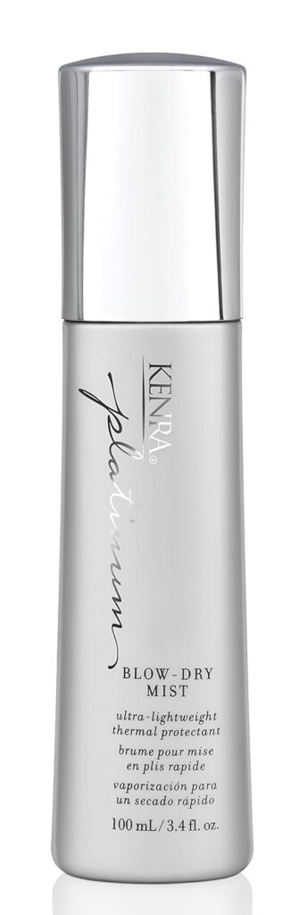A silver bottle of Kenra Platinum Blow-Dry Mist, featuring a sleek design with text detailing it as an ultra-lightweight thermal protectant. The bottle size is 100 ml (3.4 fl. oz.).