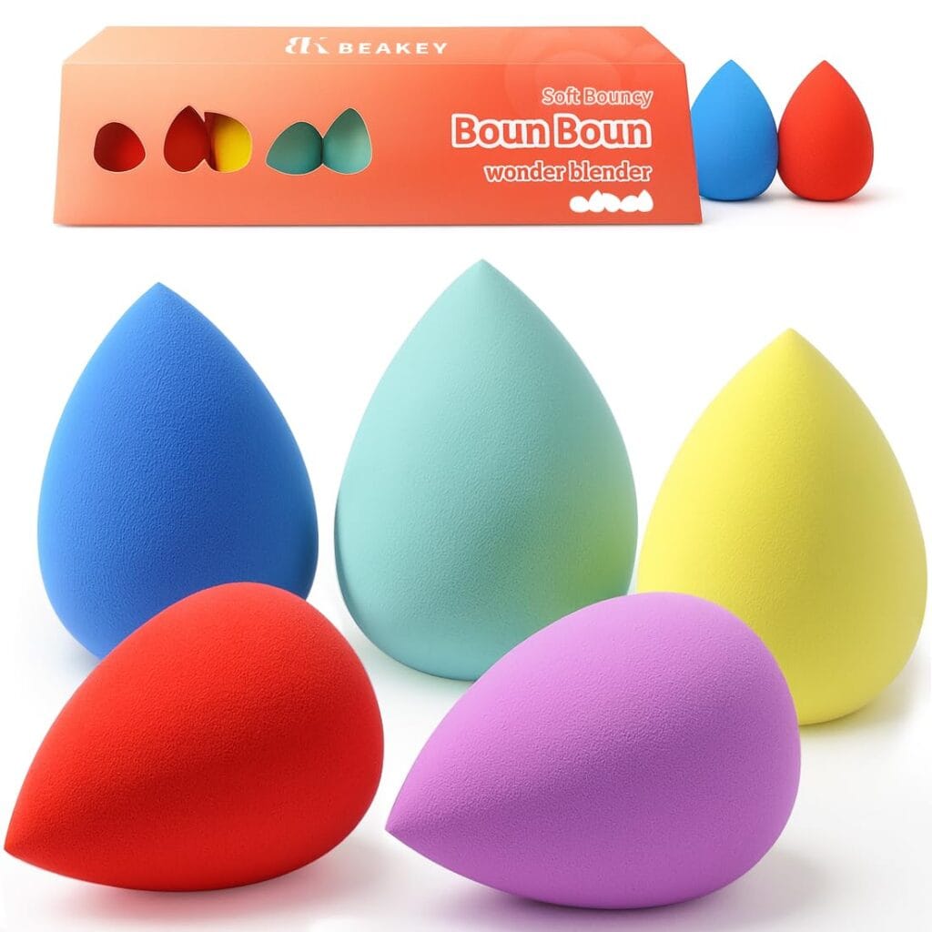 Five colorful teardrop-shaped makeup sponges are arranged in front of an orange box labeled "BEAKEY Boun Boun wonder blender." Grab this vibrant set in blue, green, yellow, red, and purple with exclusive Thursday Deals.