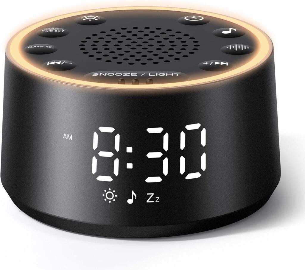 A black digital alarm clock with a white LED display showing 8:30 AM. The clock has touch buttons on top, a circular light ring, and icons for music, alarm, and snooze functions.
