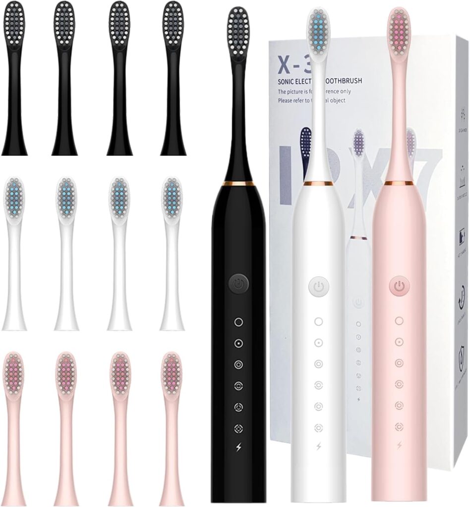 Three electric toothbrushes—black, white, and pink—with multiple interchangeable brush heads are displayed with a product box in the background. Different colored bristles show the available options.