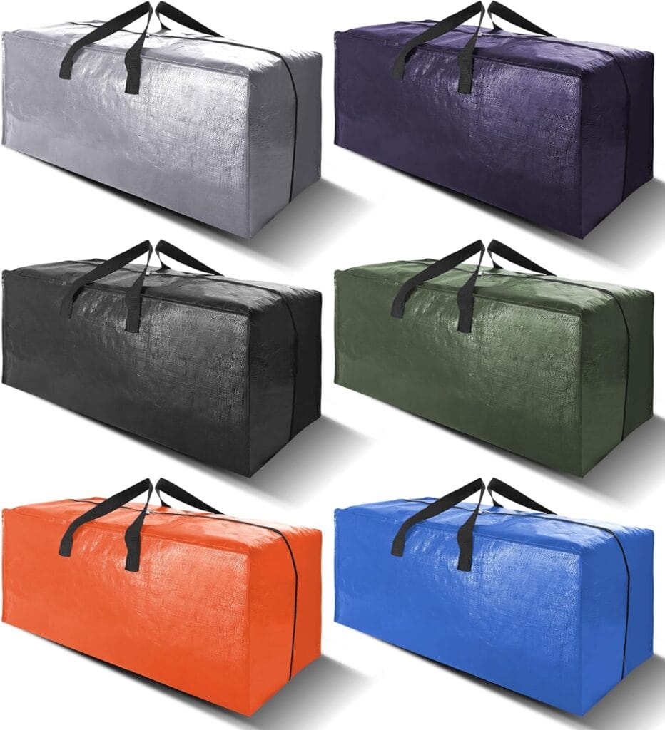 Six large rectangular duffel bags in different colors—gray, dark purple, black, green, orange, and blue—are arranged in two rows against a white background. Each bag has black handles.