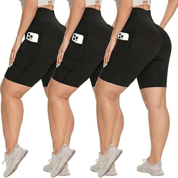 Three women wearing black high-waisted biker shorts with side pockets, each holding a smartphone in the pocket. They stand side by side, facing away in athletic shoes—perfect for those looking to snag Friday Deals on activewear.