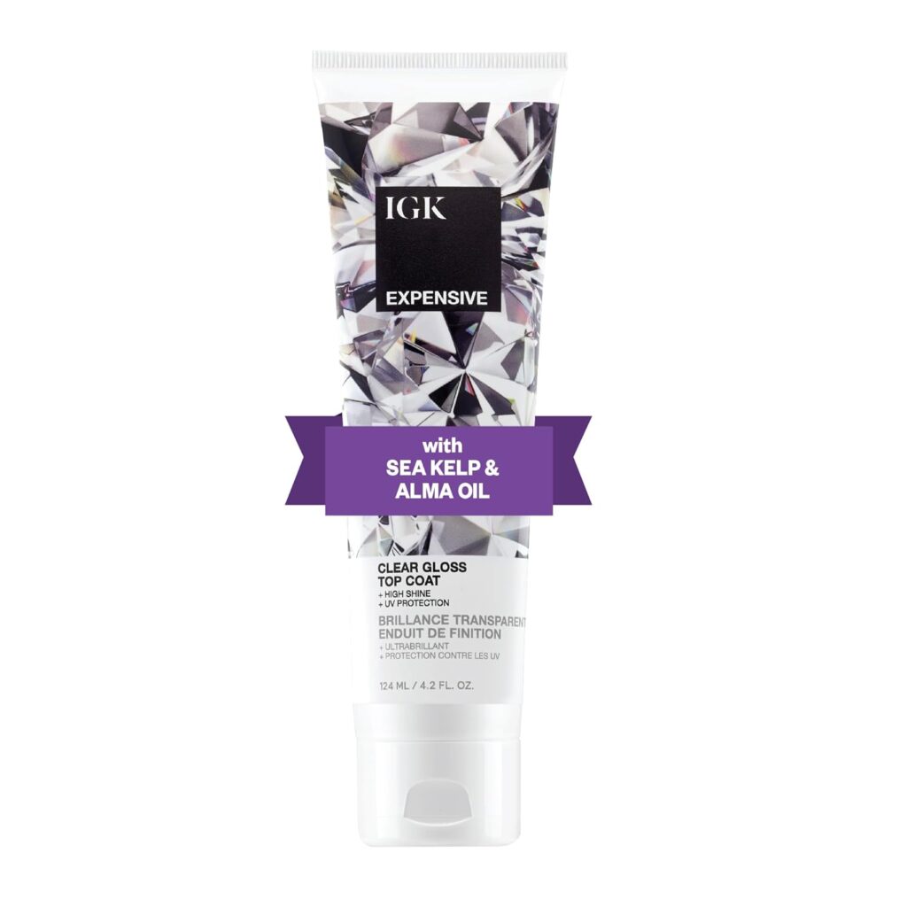 A tube of IGK Expensive Clear Gloss Top Coat with a diamond pattern design and a purple banner that reads "with Sea Kelp & Alma Oil." The tube contains 4.2 fl oz (124 mL) of product.