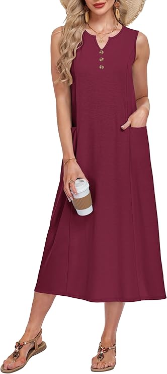 Woman wearing a sleeveless, maroon midi dress with three buttons on the chest, holding a coffee cup. She accessorizes with a straw hat, earrings, bracelets, and sandals. One hand is in her dress pocket.