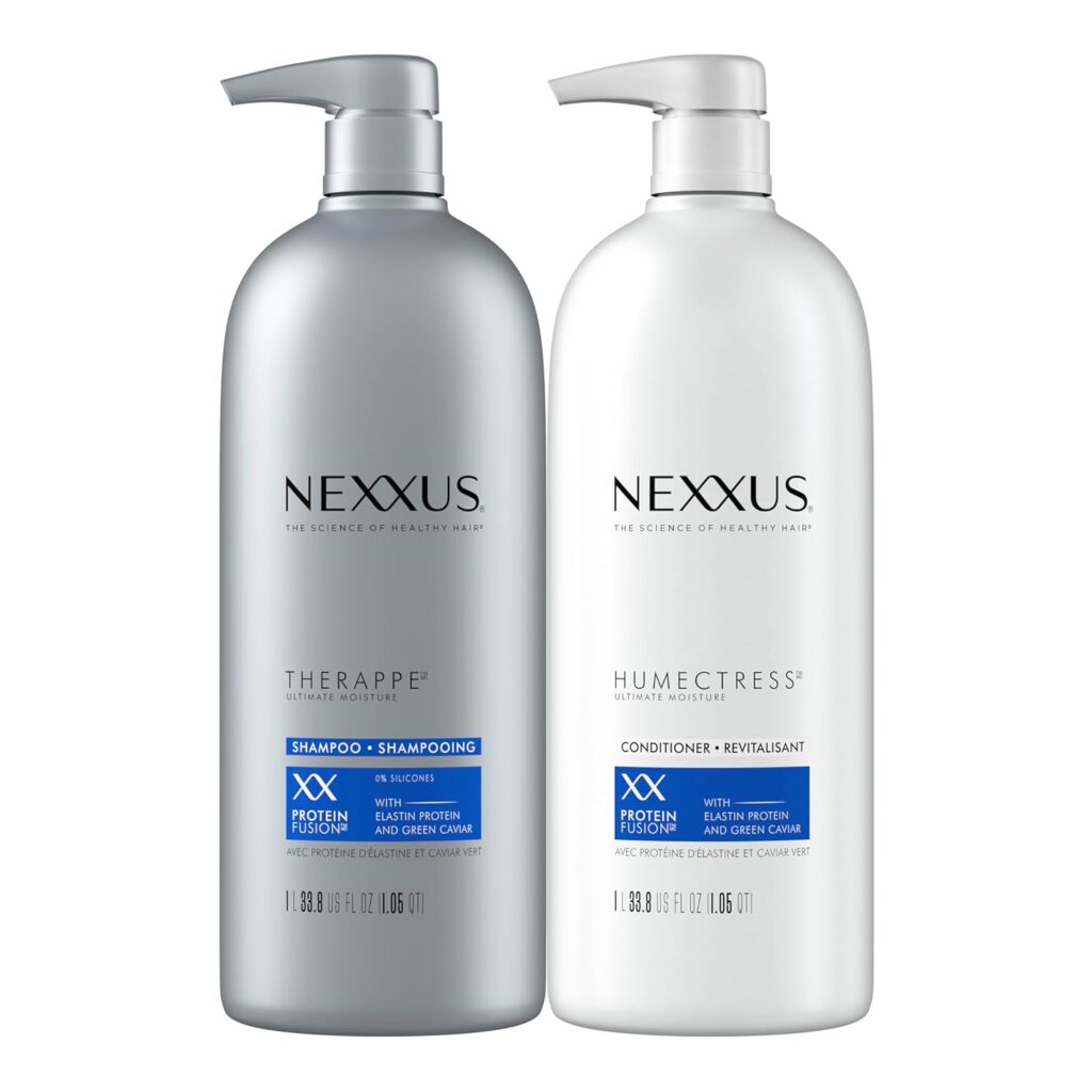 Two large bottles of Nexxus hair products. The left bottle is gray and labeled "Therappe Shampoo," while the right bottle is white and labeled "Humectress Conditioner." Both have pumps and blue product accents.