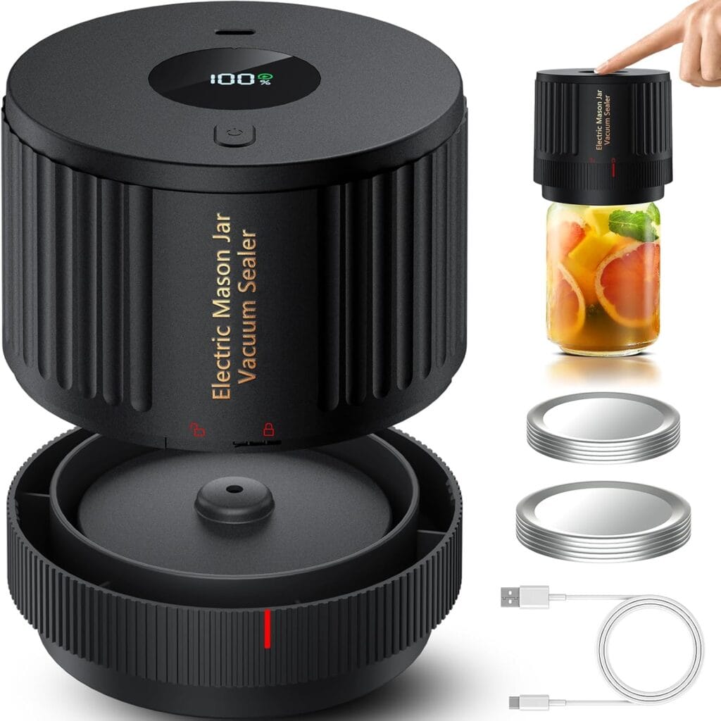 Black electric mason jar vacuum sealer kit with main device, lid attachments, USB charging cable, and a hand pressing the device onto a jar filled with fruit, demonstrating the sealing process.