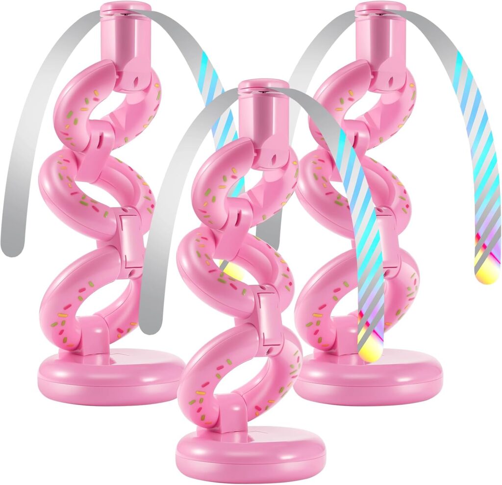 Three pink, donut-shaped holders with sprinkles, each supporting a striped, blue and white mock birthday candle with a yellow flame-like tip. The holders have linked, twisted designs and round bases.