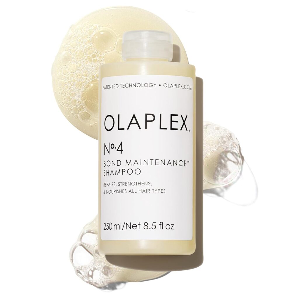 A bottle of Olaplex No. 4 Bond Maintenance Shampoo, 250 ml, with foamy shampoo on a white background. The label says it repairs, strengthens, and nourishes all hair types—perfect for scoring Thursday Deals on healthy hair.