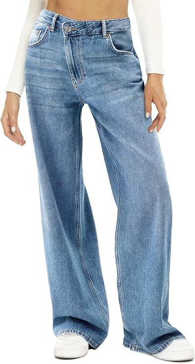 A person wearing high-waisted Women Wide Leg Jeans with white sneakers and a cropped white long-sleeve top, standing against a plain background.