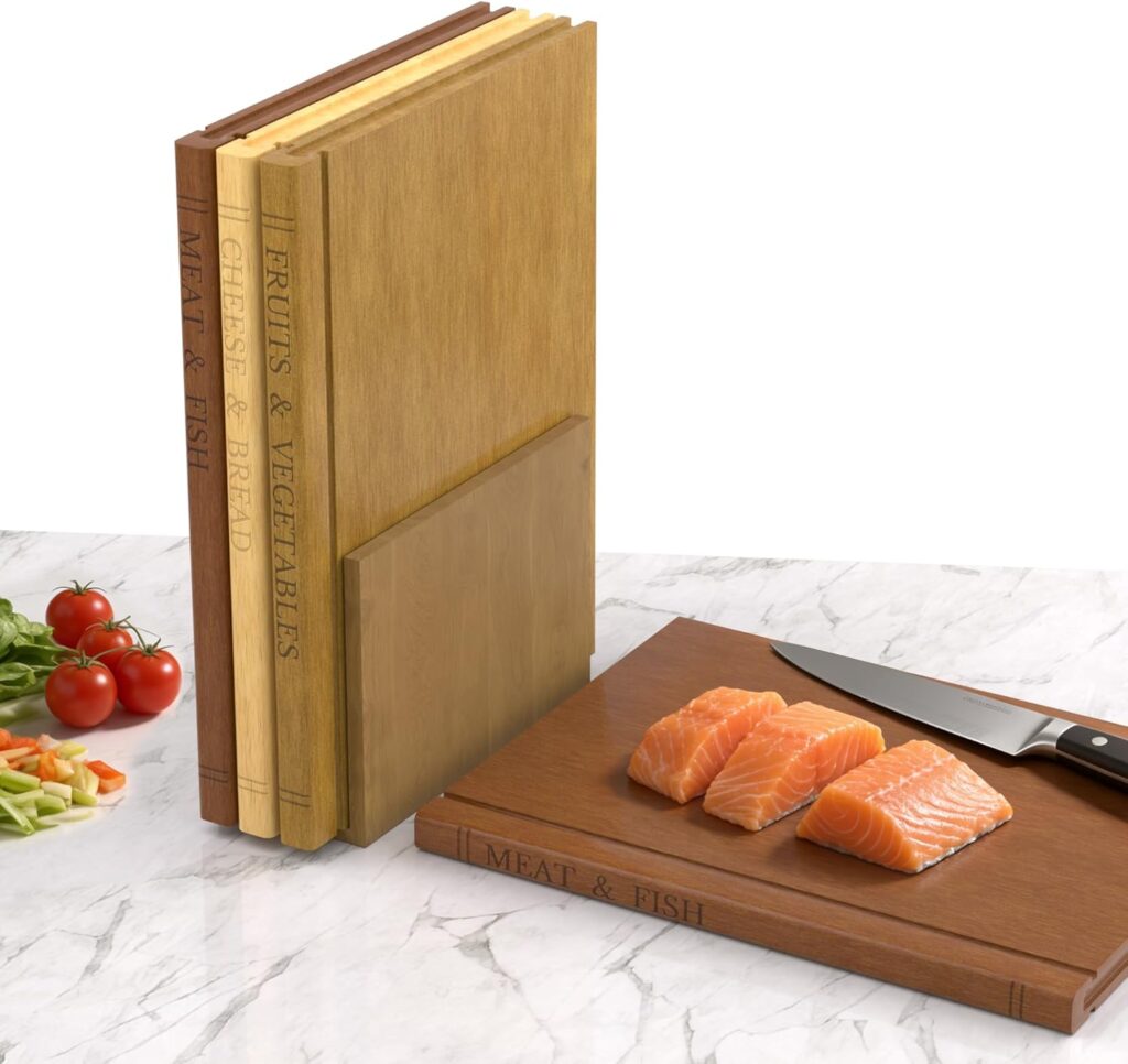 A set of four wooden cutting boards, each labeled for meat & fish, fruits & vegetables, cheese & bread, stands upright like books. One board is in use with a knife and sliced salmon—perfect for meal prep and Friday Deals. Vegetables are nearby.