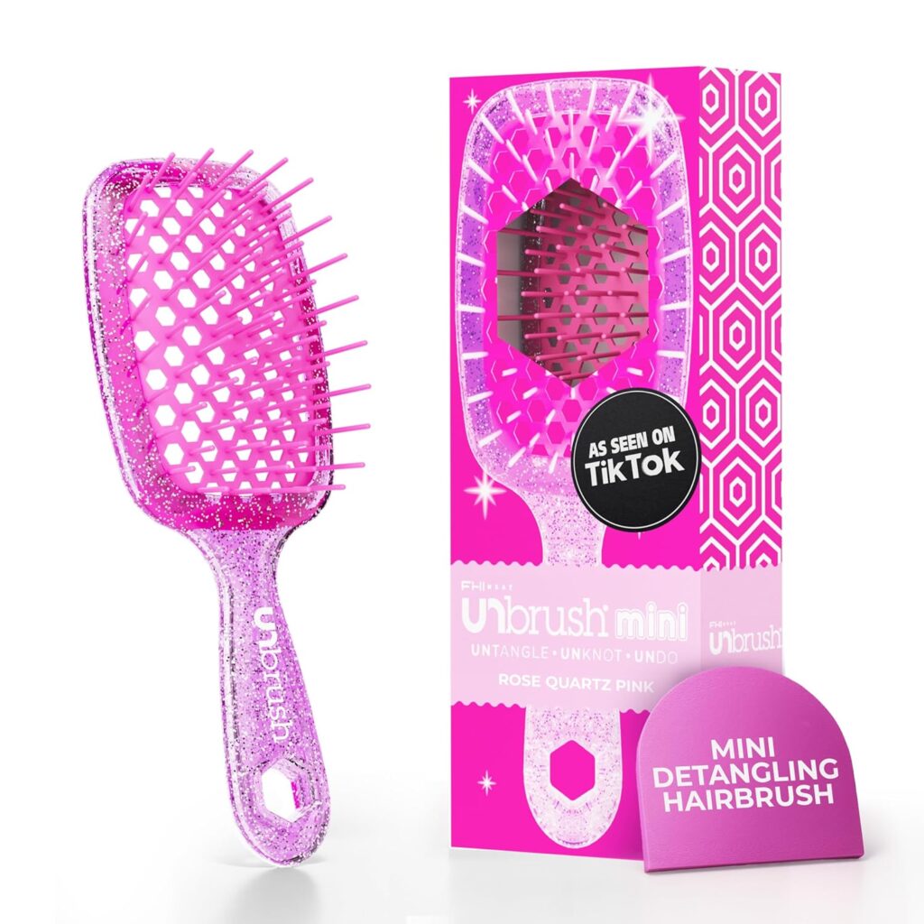A sparkly pink detangling hairbrush with flexible bristles is shown next to its matching pink box labeled “Unbrush Mini” and “Mini Detangling Hairbrush.” The box features geometric patterns and a “As Seen on TikTok” badge.