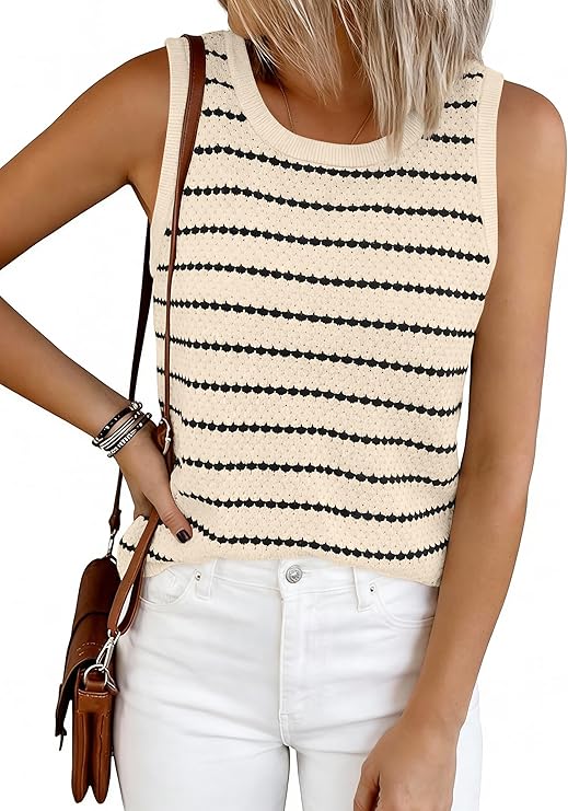 A person wearing a sleeveless, cream-colored knit top with black horizontal stripes, white pants, a brown shoulder bag, and bracelets on their wrist. Their head is not visible in the image.
