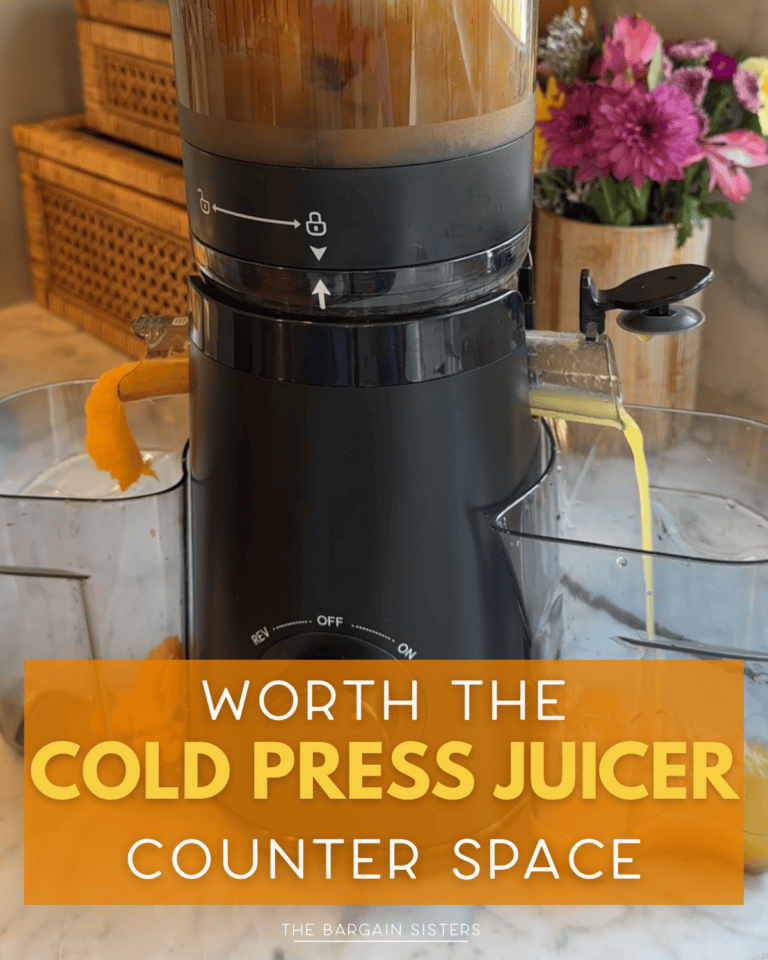 A juicer processes orange produce on the kitchen counter, juice streaming into a container as pulp exits. Flowers and woven baskets add charm. Text reads: "Worth the juicer's counter space.