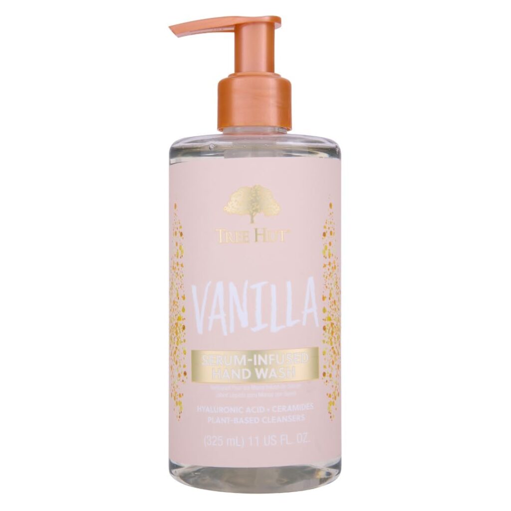 A bottle of Tree Hut Vanilla Serum-Infused Hand Wash with a peach-colored pump and label, featuring gold and white text and decorative accents. Contains 11 fl oz (325 ml). Don’t miss out on special Wednesday Deals for this indulgent hand wash!.