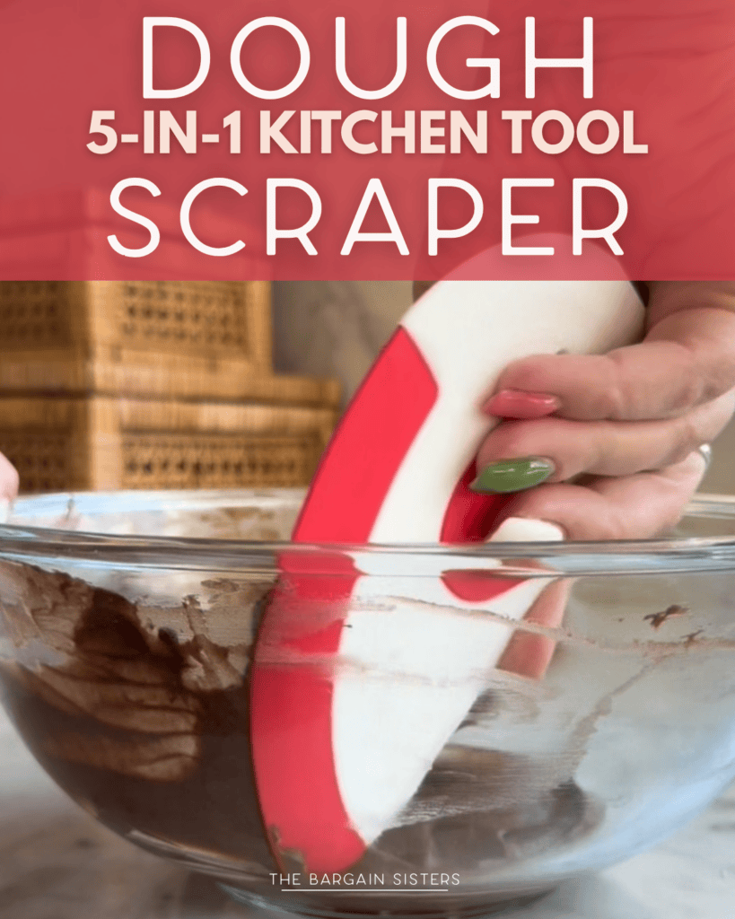 Close-up of a hand using a red and white dough scraper to mix chocolate batter in a glass bowl, with text above reading "Dough 5-in-1 Kitchen Tool Scraper.