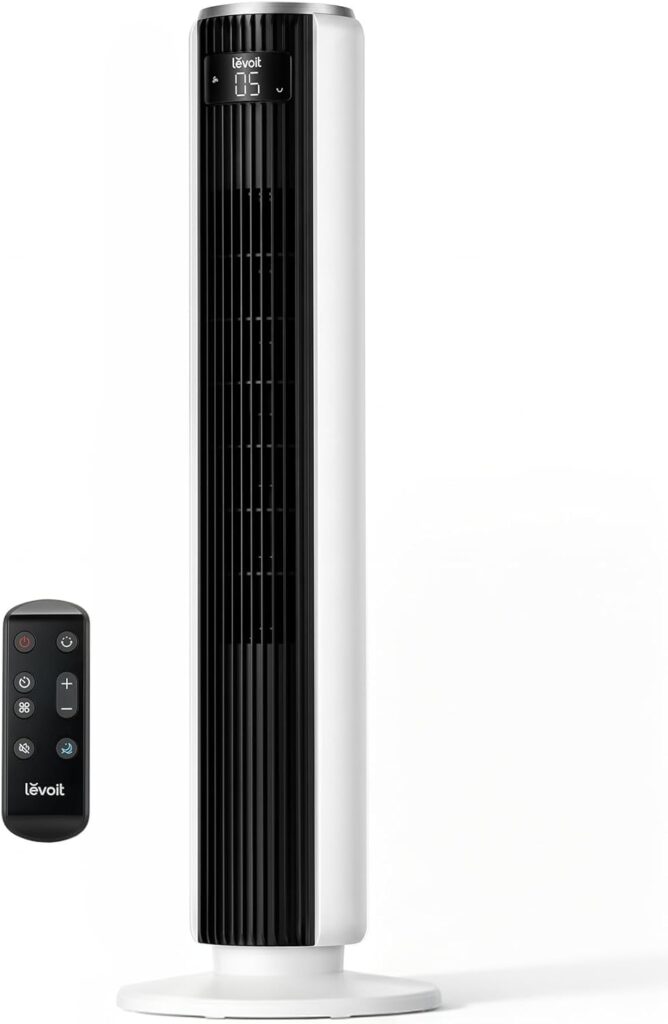 A tall, white and black Levoit tower fan with a digital display at the top is shown next to its remote control. Enjoy cool comfort and convenience—perfect for your home, especially with Tuesday Deals on both items.