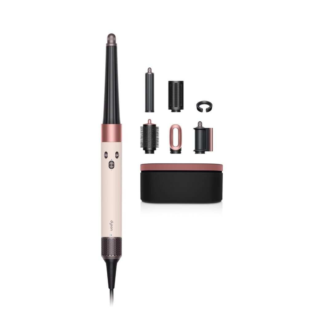 A multi-styling hair tool with a pink and black handle, six interchangeable attachments, and a matching storage case—all featured as part of Monday Deals, displayed on a white background.