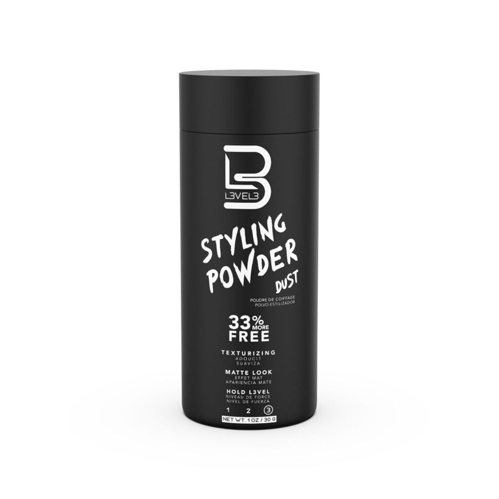 A black cylindrical container of Level 3 Styling Powder—a premium beauty essential—features white text promoting texturizing, a matte look, and 33% more free. The container holds 20g (0.7 oz) of styling powder.