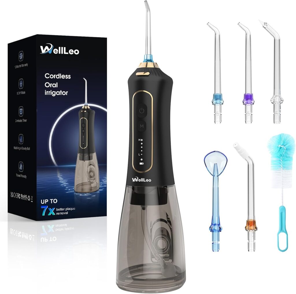 A black WellLeo cordless oral irrigator is shown with a charging base, five interchangeable nozzles, a cleaning brush, and its product box highlighting Tuesday Deals alongside the device's image and key features.
