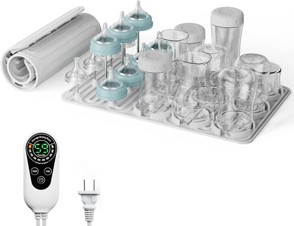 A baby bottle sterilizer set with a digital control panel, clear baby bottles, bottle nipples, a drying rack, and a bottle brush, all arranged on a white background.