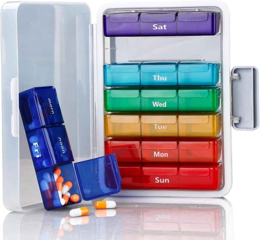 A weekly pill organizer with labeled compartments for each day and time (morning and noon). Some compartments contain blue, white, and orange pills. The open organizer displays all sections—perfect for staying on track with Tuesday Deals.