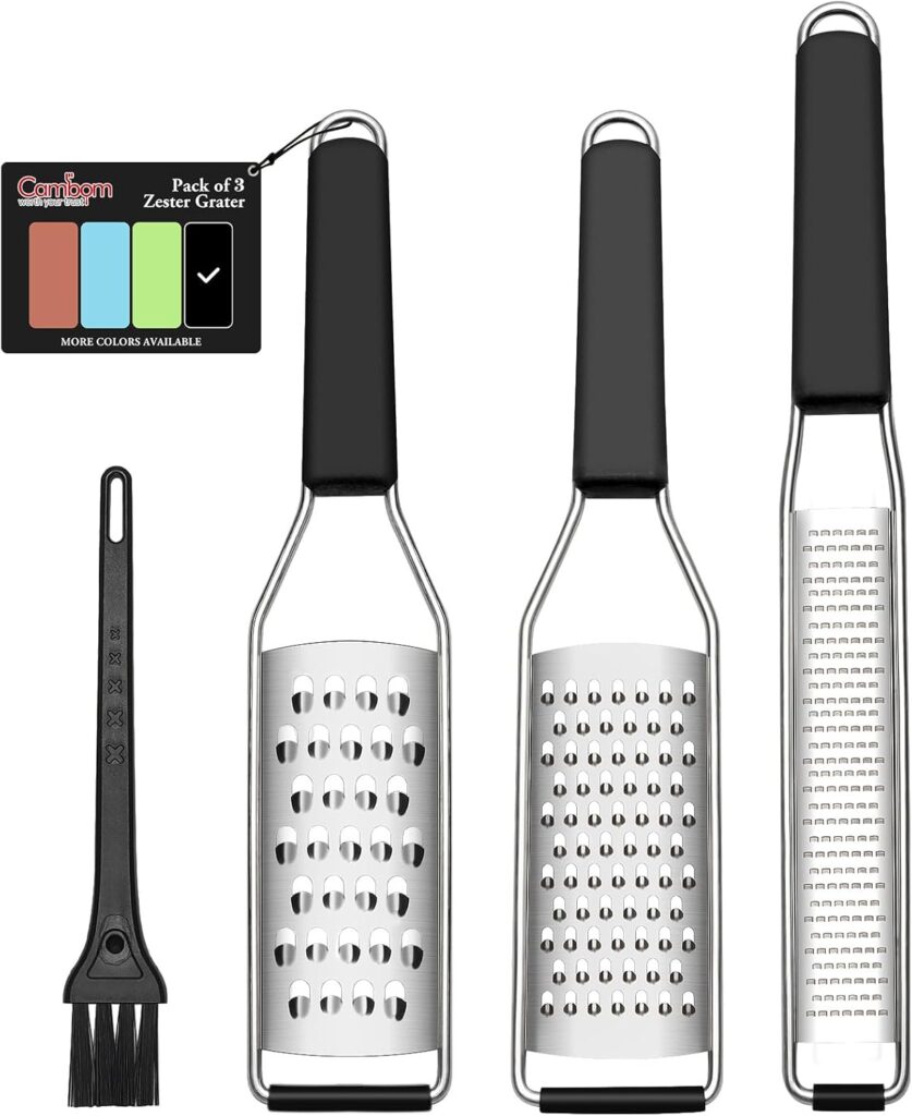 Three stainless steel zester graters with black handles, each featuring different grating surfaces, are lined up next to a small black cleaning brush and a product tag showing three color options—perfect for snagging in the Friday Deals event.