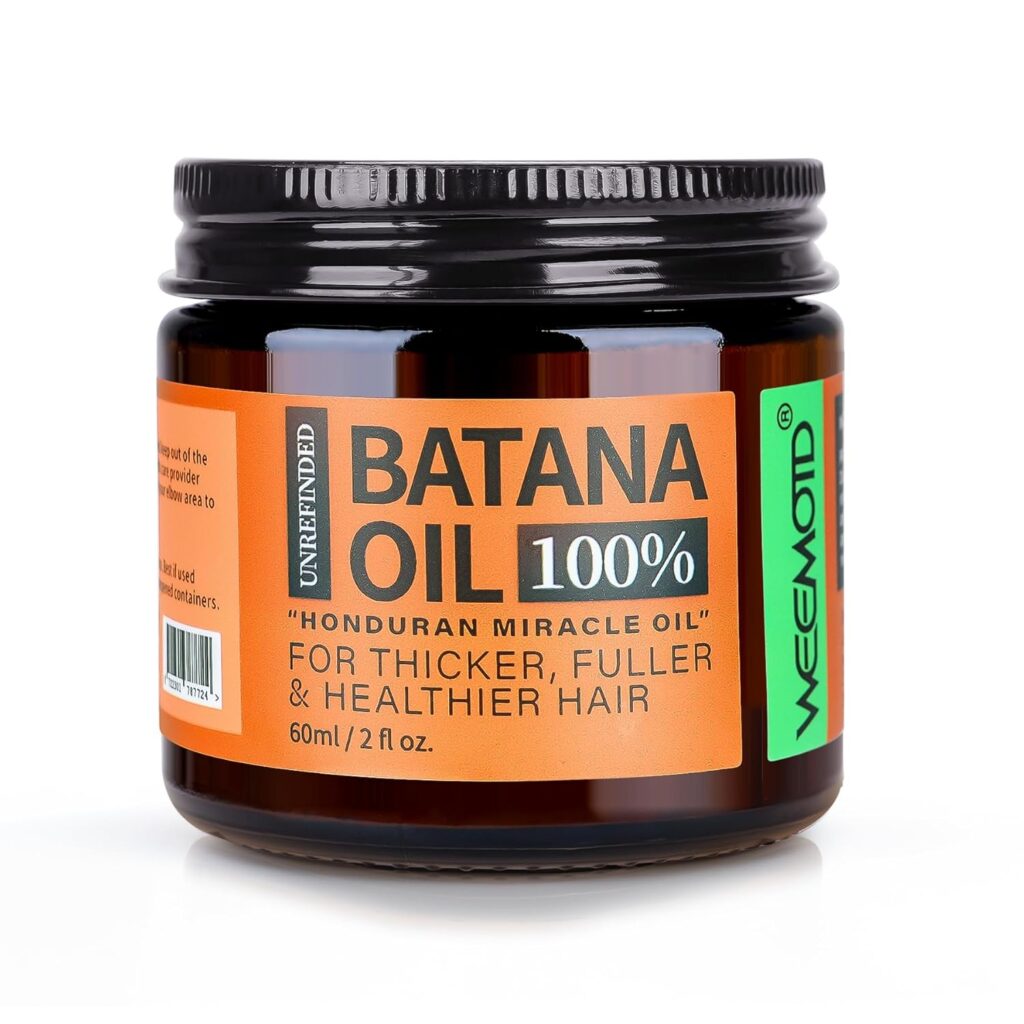 A brown jar labeled "Unrefined Batana Oil 100% 'Honduran Miracle Oil'" for thicker, fuller, and healthier hair, 60ml/2 fl oz, with a black lid and green, orange, and white accents.