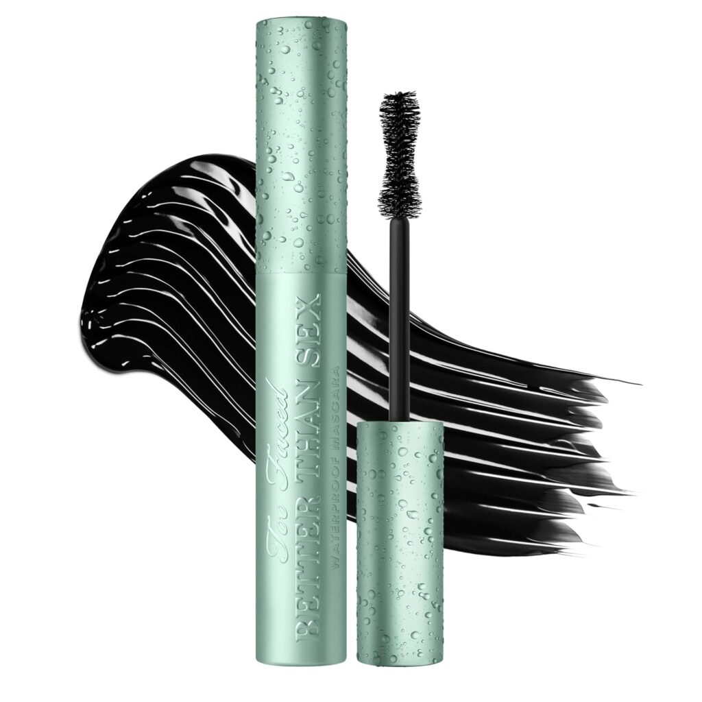A mint green Too Faced mascara tube labeled "Better Than Sex" with water droplets, shown with its black waterproof mascara wand and a bold black swipe in the background—perfect for fans of premium beauty.