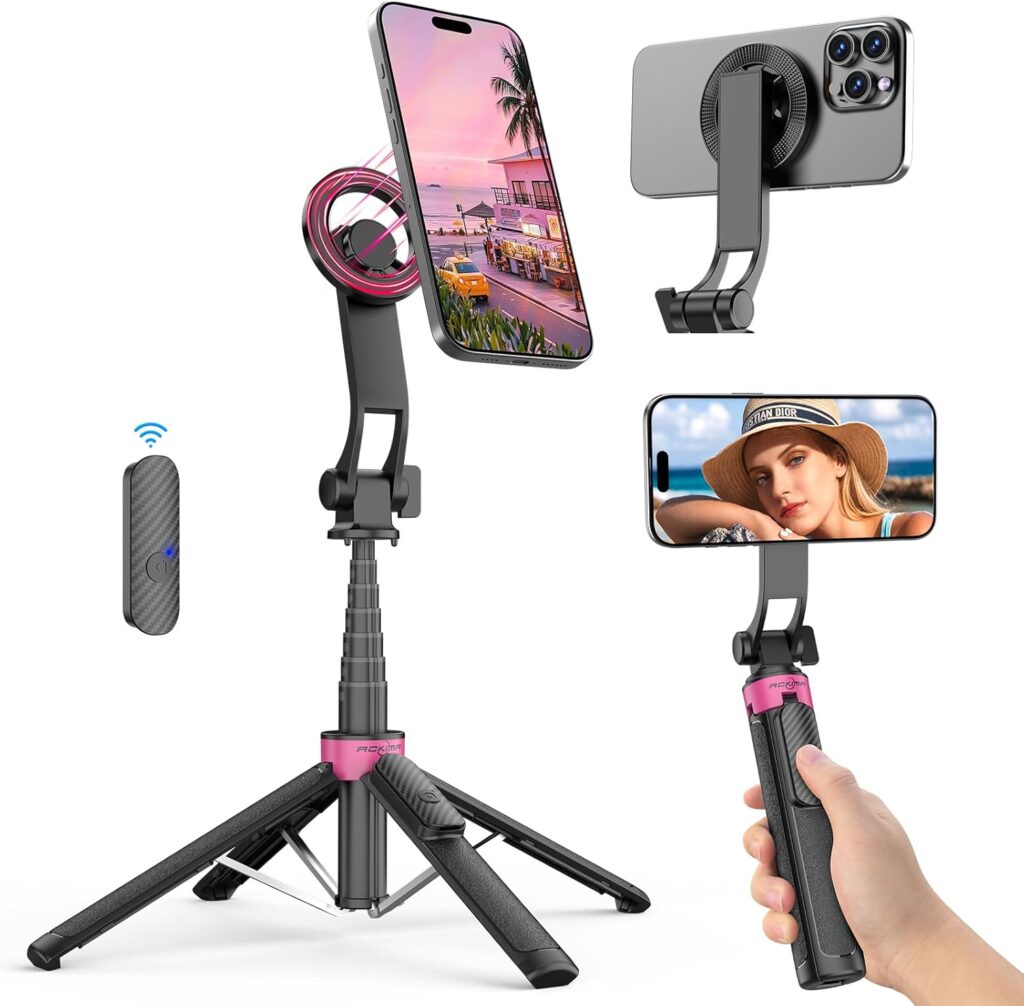 A multifunctional selfie stick tripod holds a smartphone vertically and horizontally, with a wireless remote control. One phone displays a beach scene, another shows a woman's portrait. The device is black and pink.