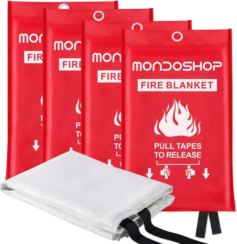 Four red MONDOSHOP fire blanket pouches with white flame graphics and instructions "PULL TAPES TO RELEASE," with one white fire blanket shown partially unfolded in front.