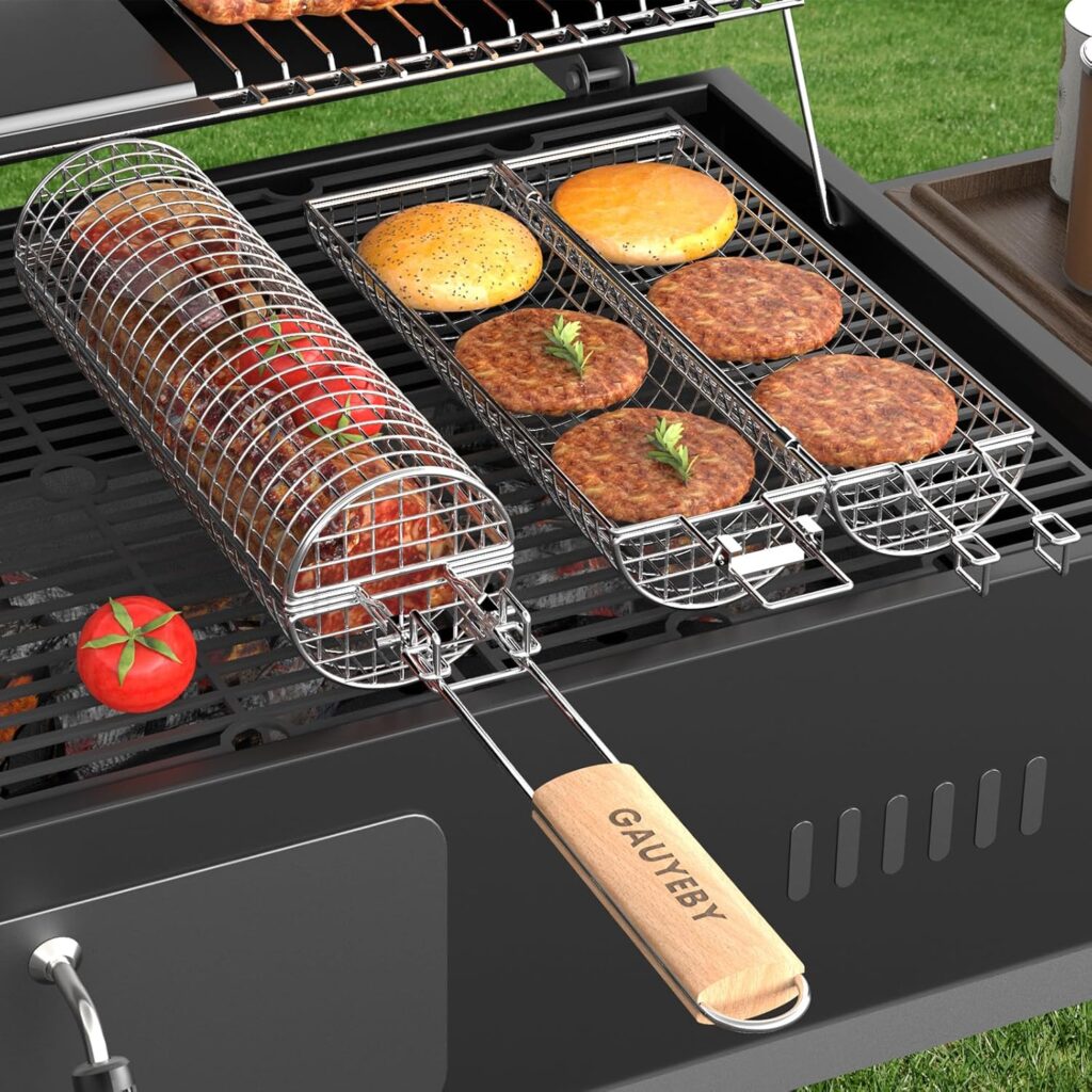 A grill with two wire baskets holding burger patties and buns, a rotisserie basket, and tomatoes. The grill is on a patio with grass in the background. One basket has a wooden handle labeled "GAUYFBY.